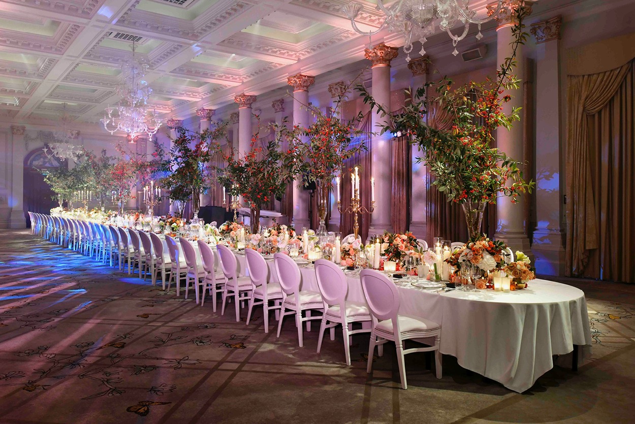 Long white table with autumnal table arrangements at The Langham London