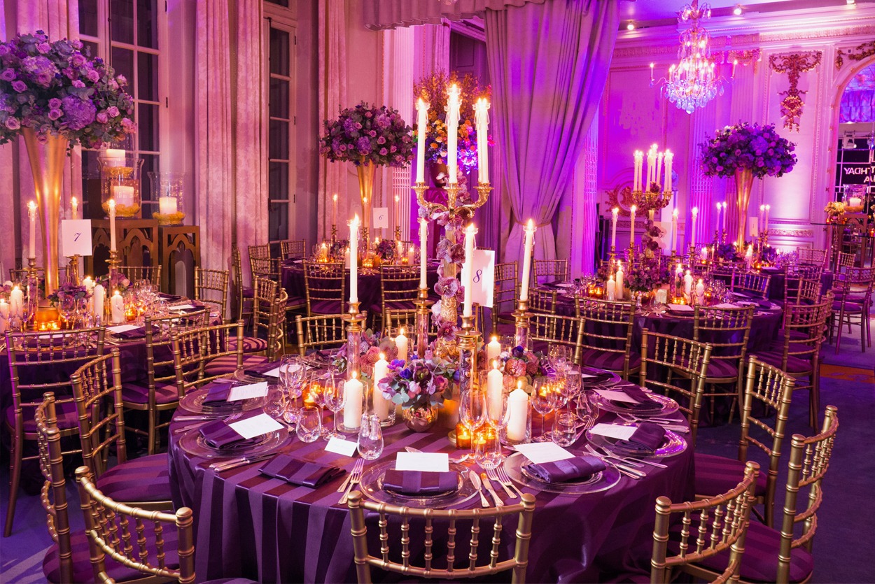 Private dinner party with tall table centres in gold and purple at The Mandarin Oriental Hyde Park